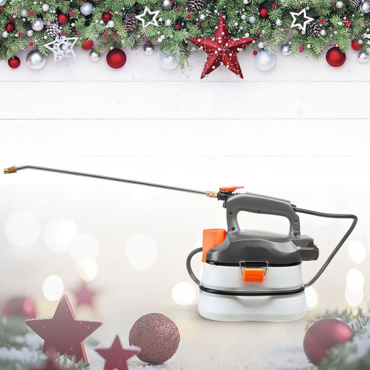Electric garden sprayer with extended nozzle on festive holiday background with ornaments