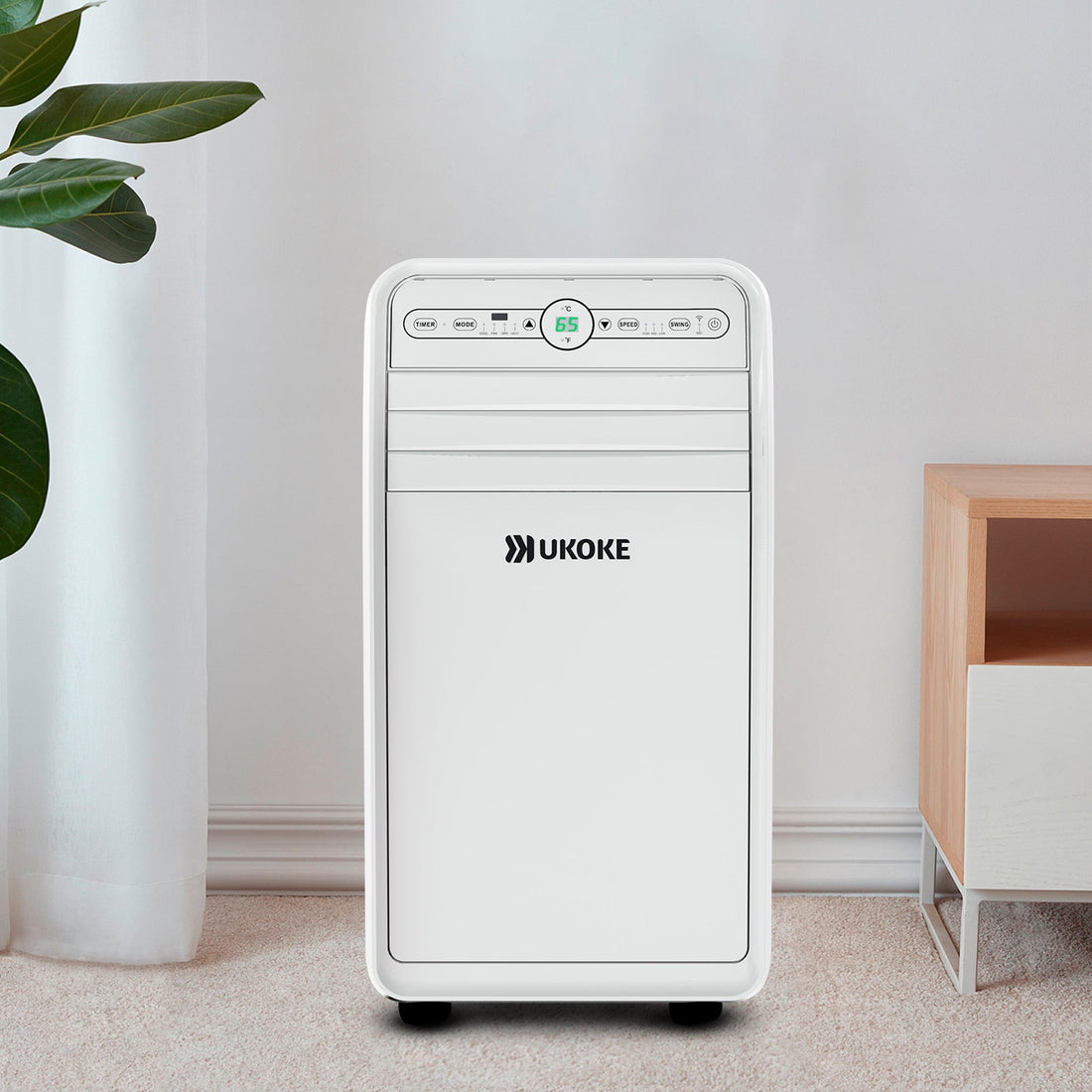 Smart portable air conditioner in a modern living room setting on carpeted floor