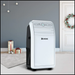 Portable air conditioner in a modern living room with festive decor and gift boxes