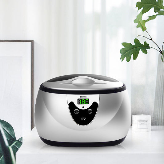 Digital ultrasonic jewelry cleaner with LED display on a countertop, modern home setting